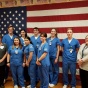 Nursing students and faculty with American flag. 
