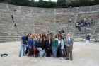 Students and faculty in ancient Greek stadium. 