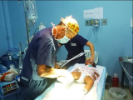 Doctor examining baby's foot. 