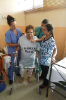 Patient with walker and nurses. 