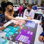 Students playing a collaborative board game. 