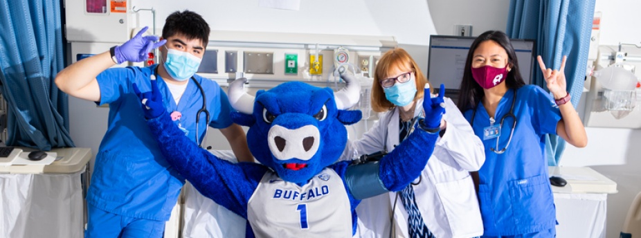 Nursing students and faculty with UB mascot. 