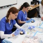 Zoom image: ABS students practice injections. 