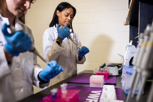 Nurses working at a lab bench. 