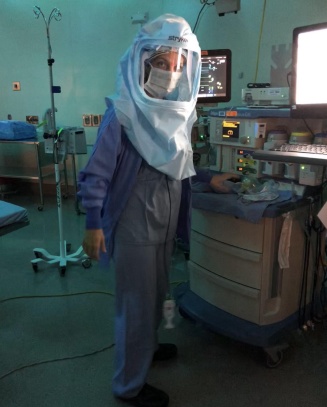 nurse anesthetist student wearing surgical suit with mask. 